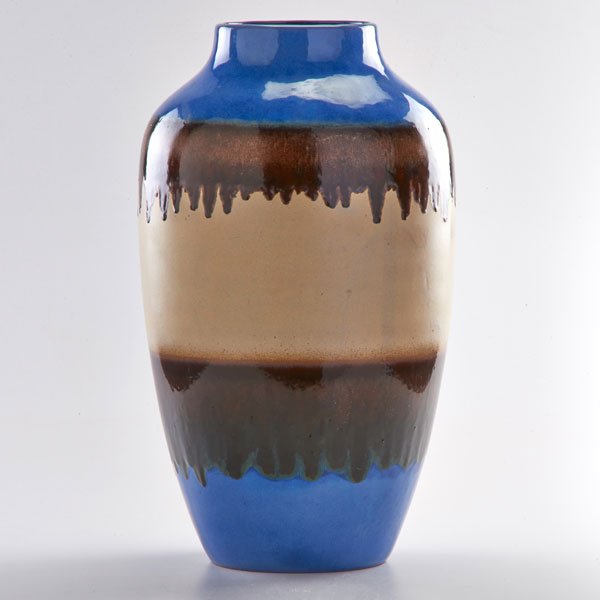 RAYMOR: Floor vase in blue, copper, and cream glazes, 1960s; Glazed earthenware; Raymor paper label; 21" x 10" dia.