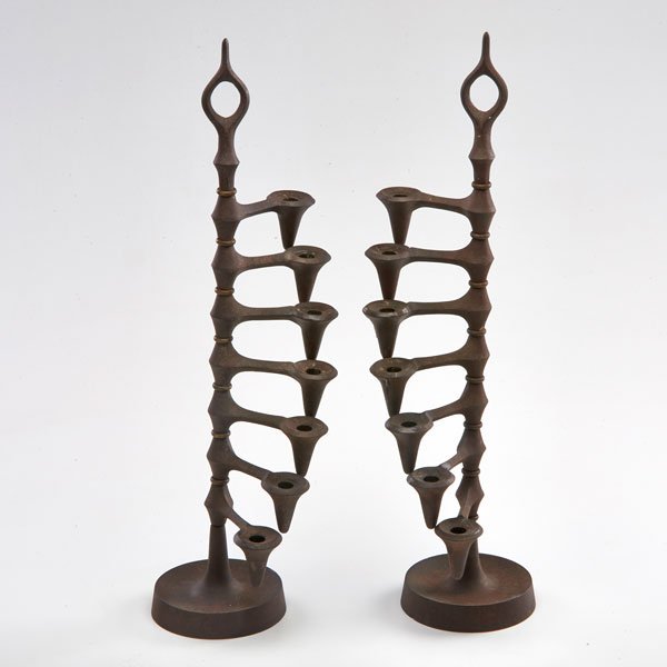 JENS QUISTGAARD: Pair of adjustable seven-light candleholders, Denmark, 1960s; Iron; Both marked; As shown: 19" x 4" dia.