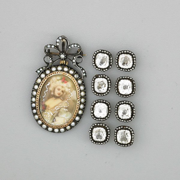 ANTIQUE PORTRAIT BROOCH AND SET OF EIGHT BUTTONS: Portrait miniature, Spanish silver-topped gold, split pearls, ca. 1900, 2 1/4" x 1 3/8"; Eight buttons of paste and cut steel, ca. 1800, 1/2"