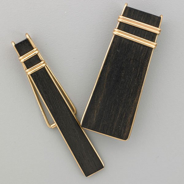 ALLAN ADLER 14K GOLD AND EBONY TIE AND MONEY CLIPS: Spare and elegant forms; Marked Allan Adler, 14k handmade, #204, #208; 2 1/4" and 2 1/2"