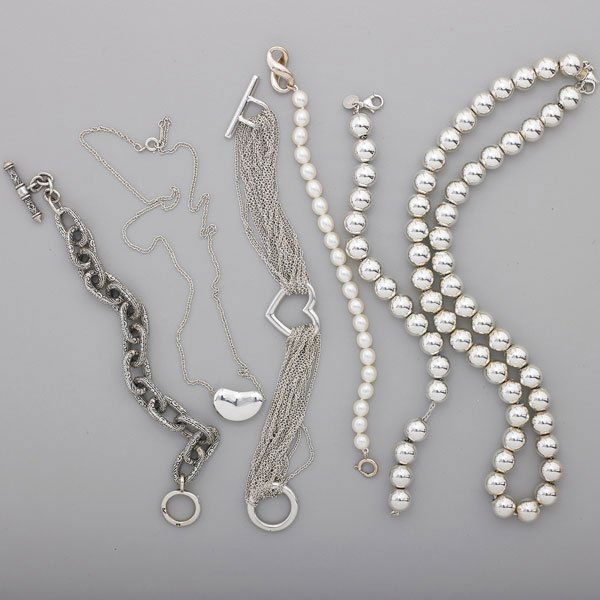 STERLING SILVER JEWELRY, TIFFANY OR KONSTANTINO: Six pieces, five by Tiffany & Co.: Elsa Peretti "Bean" pendant on 18" chain, 1/2" x 3/4", open heart mesh multi strand bracelet with toggle closure, 6 1/2", necklace 18" and bracelet 7", freshwater pe