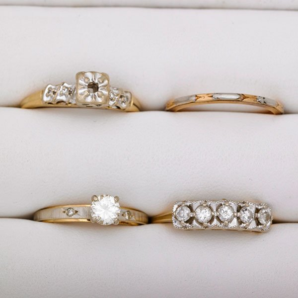 THREE DIAMOND RINGS AND A GUARD RING: Diamond solitaire, approx. .50 ct. in 14k wg. and yg.; Five-stone band, approx. .50 ct. TW; Sweetheart semi-mount; Bicolor guard; 20th c.; Size 7-8 1/2; 5.8 dwt.
