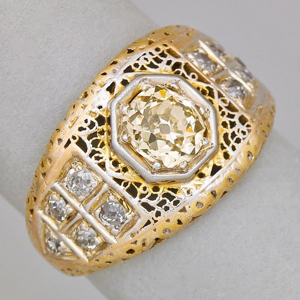 YELLOW DIAMOND RING: OMC diamond of yellow hue, approx. .78 ct. hexagonally set within filigree and colorless diamonds, ca. 1915; Size 6 1/2; 2.3 dwt.