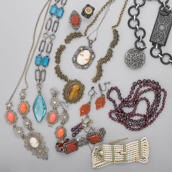 GROUP OF COSTUME JEWELRY, SECOND QUARTER 20TH C.: Sixteen pieces, includes silver, hardstone and carved shell cameos: Graduated faceted garnet necklace, 32" and earrings, drop 1 1/4"; Silver marcasite and faceted carnelian link bracelet, 6 1/2", and 