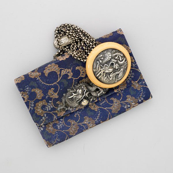 MEIJI JAPANESE SILVER MOUNTED TOBACCO PURSE/POUCH: Brocade purse and celluloid button with dragon motif silver mounts; Unmarked; 3 1/4" x 5", chain 4"
