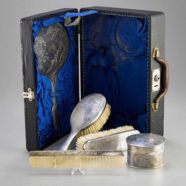 CHINESE EXPORT SILVER VANITY SET: Five pieces: Cylindrical powder jar, two brushes, hand mirror and comb in fitted case, scenic chasings depict nobility and domestic pursuits; Zeesung, 20th c.; Monogrammed; Longest piece 10 1/2"