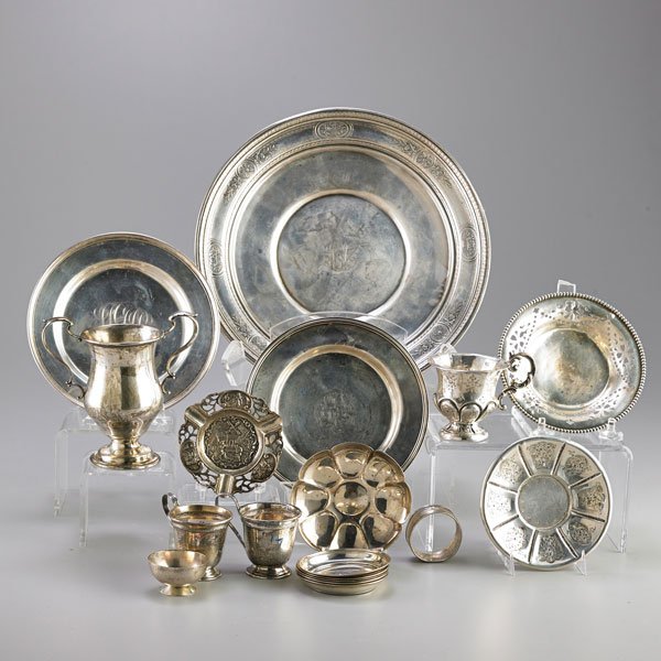 AMERICAN AND FOREIGN SILVER HOLLOWARE: Eighteen pieces: French cup and saucer; Reed and Barton loving cup; Two demitasse holders; Salver, 10"; Nine dishes or plates; Ashtray; Egg cup; Napkin ring; 20th c.; 30.5 OT