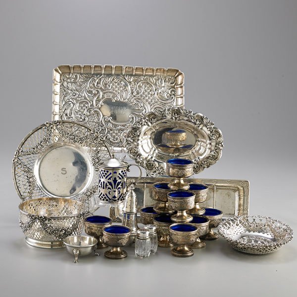 SMALL ORNAMENTAL SILVER FOR THE TABLE OR DESK: Twenty-five pieces: Tiffany & Co. pen tray, 1909-1947; Garland and lattice bowl and dish, retailed by Tiffany & Co.; Two Shreve, Crump & Low garland and lattice bonbon bowls; Whiting repousse oval dis
