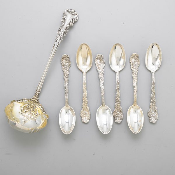 STERLING TOWLE PUNCH LADLE AND GORHAM SOUP SPOONS: Seven pieces: Edwardian parcel gilt ladle, embossed scroll and fluted bowl, baroque handle, 12 1/2"; Six oval spoons, Gorham "Old Medici" pattern by Antoine Heller, copyright 1883, marked with Gorham 