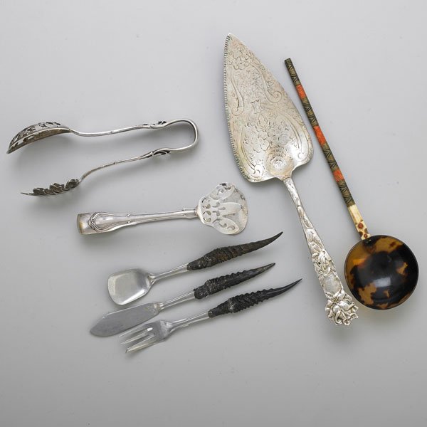 STERLING AND OTHER UTENSILS: Seven items: Two pairs of sterling tongs in pierced design, one Watson Co., one retailed by Piaget & Co.; Sterling recast pie server, unidentifiable makers mark; Horn and stainless steel cheese access