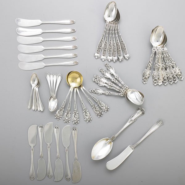 COLLECTION OF FLORAL SPOONS AND OTHER FLATWARE: (12) Gorham “Lilly” teaspoons, 5 ¾”; (6) Gorham “Dresden” teaspoons, 5 ¾”; (6) Gorham “Orange Blossom” ice cream spoons with gilt bowl, 5 3/8”; (6) Whiting “Duchess” butter spr