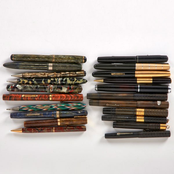 WATERMAN FOUNTAIN PENS, ETC.: Twenty-one: Waterman's Red Ripple, Waterman's hard plastic Safety Pen, Stratford fountain pen, etc.; 20th c.; All Marked; Longest: 5 1/2"