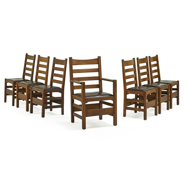 GUSTAV STICKLEY Seven ladderback chairs: GUSTAV STICKLEY Assembled set of ladderback dining chairs, six side- and one arm-, Eastwood, NY, ca. 1905; Some with red decals; Arm: 40" x 23 1/2" x 19 1/2"