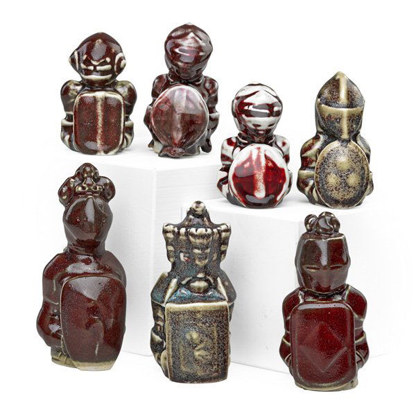 ERNEST CHAPLET Seven chess pieces: ERNEST CHAPLET (1835 - 1909) Seven porcelain chess pieces, sang-de-boeuf glazes, France, 1880s; All signed; Largest: 5 1/4" x 2"