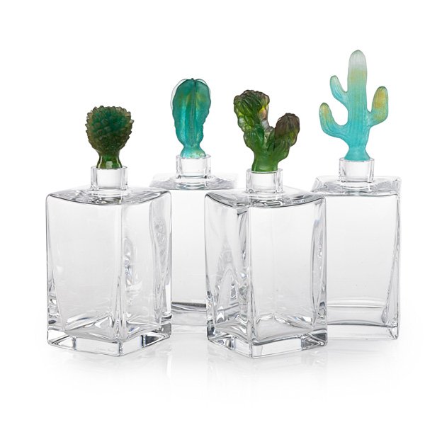 DAUM Four cactus decanters: DAUM Four glass decanters with pate-de-verre cactus stoppers, France, late 20th century; Etched Daum France; Tallest: 11 1/2" x 3 1/2"