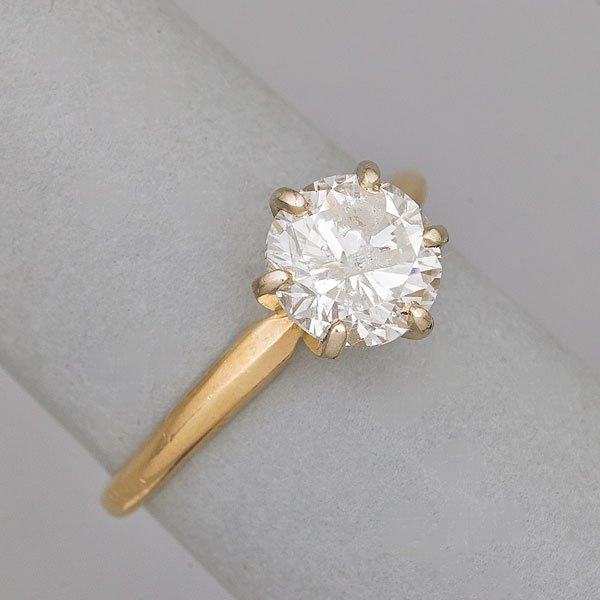 DIAMOND 14K GOLD SOLITAIRE RING: Circular brilliant cut diamond with faceted girdle, approx. 1.60 cts., ca. 1965