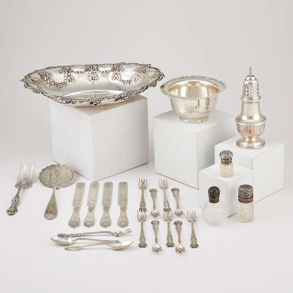 SILVER TABLE ACCESSORIES AND FLATWARE: Twenty-four pieces: Sheffield oval pierced and embossed bowl; Shreve "Dolores" pattern bowl, marked Shreve & Co., San Francisco, 5 3/8" x 3"; (3) English cut glass scent bottles with embossed silver l