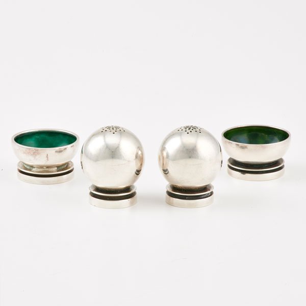 GEORG JENSEN PYRAMID STERLING SALT AND PEPPER SETS: Four pieces, post-war, Denmark, designed by Harald Nielsen: Two spherical pepper castors and two salt cellars with green enameled bowls, #632; 1 5/8" dia.; 4.57 OT