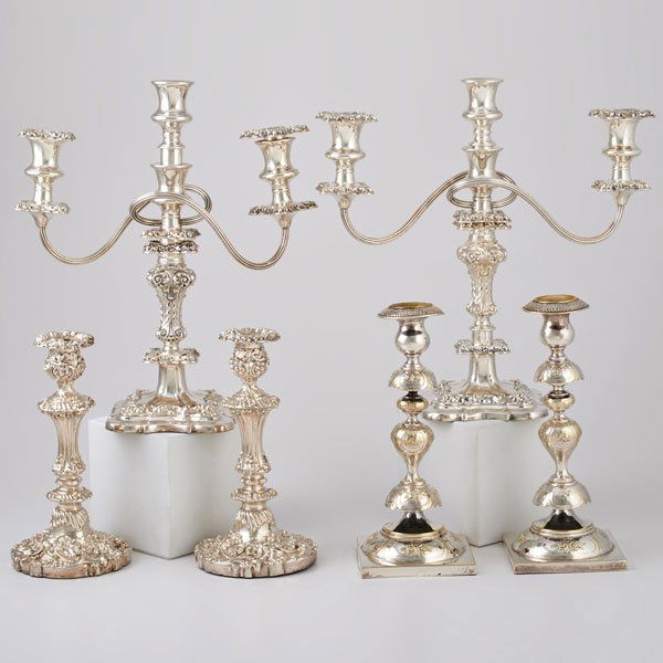 TWO PAIRS CANDELSTICKS AND A PAIR OF CANDELABRA: Rococo weighted sterling candlesticks with faux English marks, 9 1/4"; Silver plate Sabbath candlesticks, Fraget, Poland, 1896, 10 1/2"; Pair of weighted sterling three-light candelabra, 14", converts
