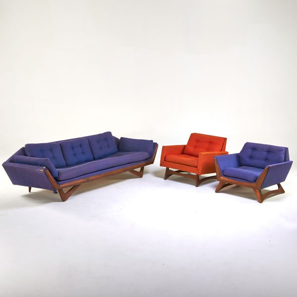 ADRIAN PEARSALL; KRAFT ASSOCIATES: Sofa and two lounge chairs, Wilkes Barre, PA, 1960s; Sculpted walnut, upholstery; Manufacturer labels; Sofa: 26" x 101" x 35"