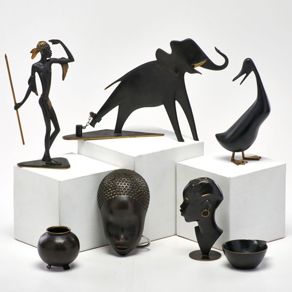 HAGENAUER WIEN: Six pieces: elephant, duck, two cabinet vases, and two tribal pieces by Richard Rohac, together with a similar mask, Vienna, 20th c; Wood, brass, bronze; All marked; Elephant: 7" x 10 1/2" x 3 1/2"