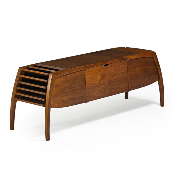 ROBERT MARCH: Stereo cabinet, Worcester, MA, 1980s; Sculpted walnut with brass hinges; Unmarked; 24" x 66 1/2" x 21 1/2"