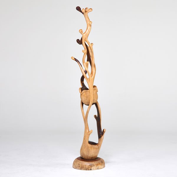 STUDIO: Sculptural coat rack, 1980s; Carved exotic woods; Unmarked; 72" x 15 1/2" dia.