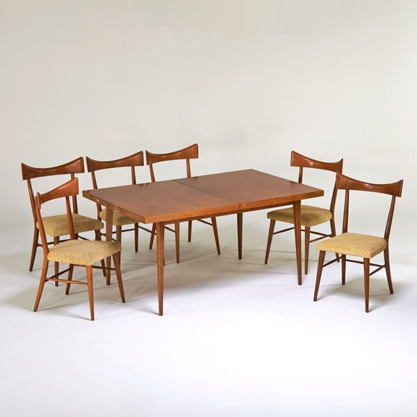 PAUL McCOBB; WINCHENDON FURNITURE CO.: Extension dining table and six side chairs, USA, 1950s; Birch, upholstery; Unmarked; Table: 29" x 60" 38", chair: 35" x 20 1/2" x 20"