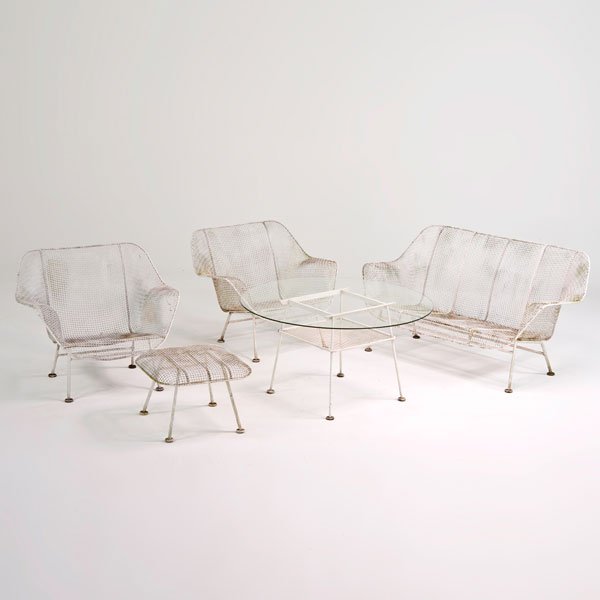 RUSSELL WOODARD: Sculptura series furniture: settee, two lounge chairs, ottoman and coffee table, USA, 1950s; Unmarked; Enameled steel and glass; Settee: 28" x 52 1/2" x 29", lounge chairs: 27" x 32" x 30", coffee tab