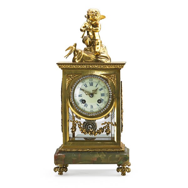 CRYSTAL REGULATOR CLOCK: Putti figure on top, jeweled dial and pendulum, eight day time and strike movement, beveled glass, France, ca. 1900; 16" x 7 1/4" x 5"