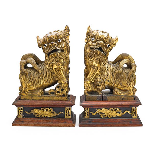 PAIR OF CHINESE FOO DOGS: Gilded carved wood, 19th c.; 14" x 9" 5 1/2"