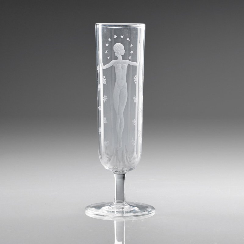 WALTER DORWIN TEAGUE; STEUBEN Vase with figure: WALTER DORWIN TEAGUE (1883 - 1960) STEUBEN Glass vase etched with nude female figure, stars, and sprigs, Corning, NY, 1932; Etched Steuben; 11 3/4" x 4 1/2"