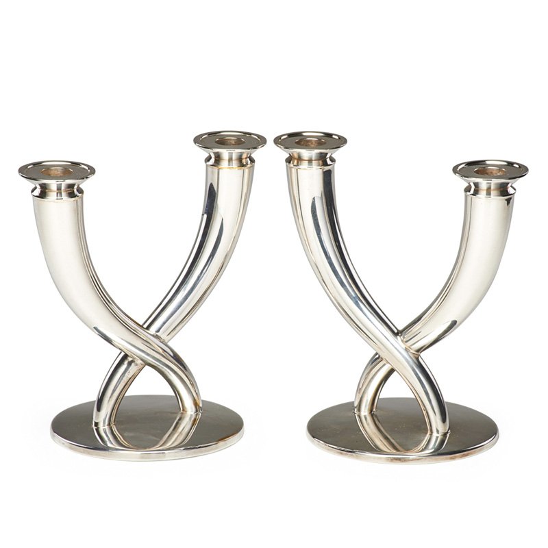 GIO PONTI; CHRISTOFLE Pair of candelabra: GIO PONTI (1891 - 1979) CHRISTOFLE Pair of candelabra, France, 1960s; Silver-plated metal; Stamped Christofle France with hallmarks; 8" x 8" x 5"