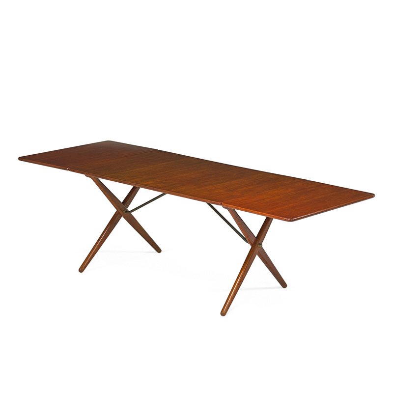 HANS WEGNER; ANDREAS TUCK Dining table: HANS WEGNER (1914 - 2007) ANDREAS TUCK Drop leaf dining table, Denmark, 1960s; Teak, brass; Branded; Open: 28 1/2" x 90" x 34"