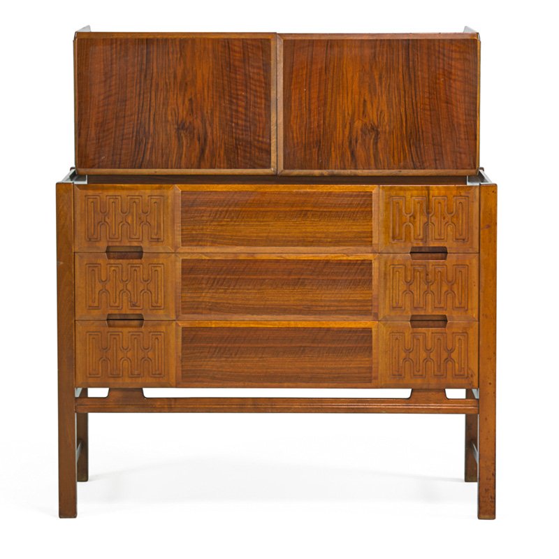 EDMUND SPENCE Chest-on-chest: EDMUND SPENCE Chest-on-chest, Sweden, 1950s; Figured walnut, carved and stained beech; Ink stamped MADE IN SWEDEN Factory No. 14; Overall: 46 1/2" x 42" x 20", height of lower chest: 32 1/2"