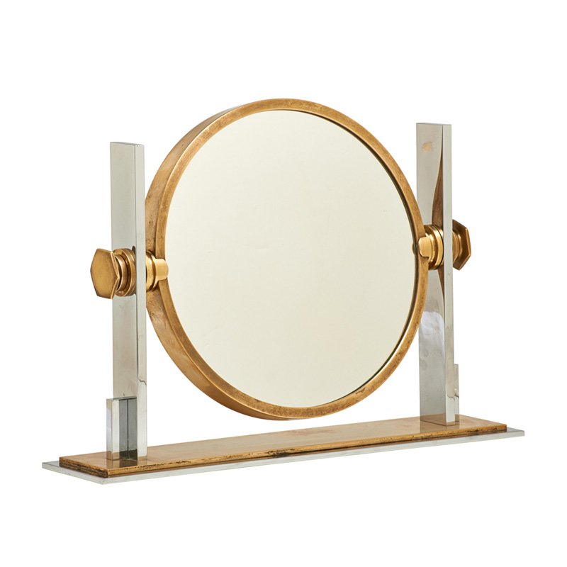 KARL SPRINGER Mirror: KARL SPRINGER (1931 - 1991) Reversible mirror, New York, 1970s; Brass, chromed metal, mirrored glass; Unmarked; 15" x 21" x 5" Literature: Karl Springer trade catalogue