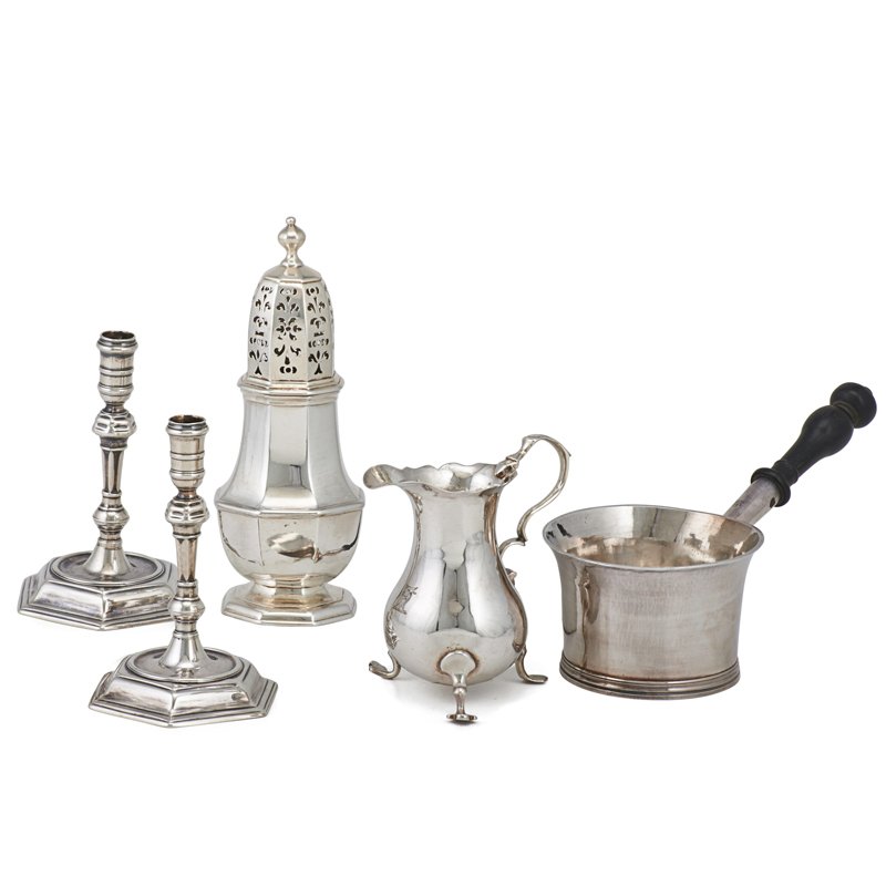 18TH CENTURY LONDON SILVER: Five pieces: Sugar caster, Charles Adam, Britannia, 1716; Wood handled brandy saucepan, William Fleming, Britannia, 1717; Pair of Britannia taper sticks, London, 1721, indistinct maker; Georgian sterl