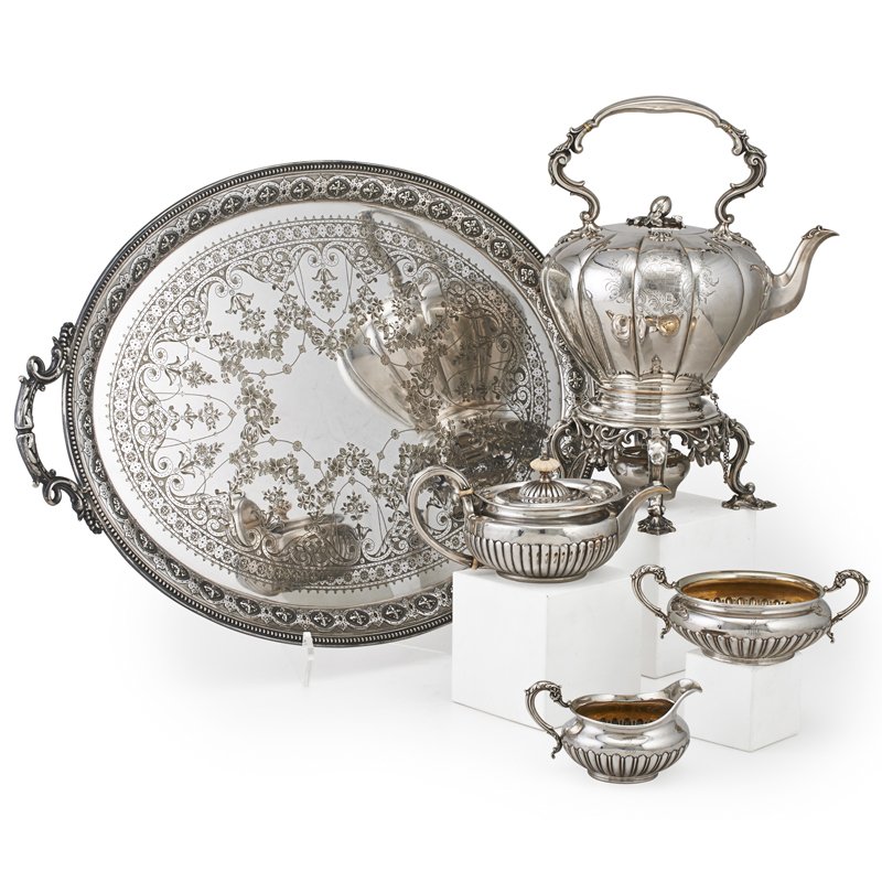 ASSEMBLED ENGLISH SILVER AND PLATE TEA SERVICE: Four pieces. Four hollow sterling vessels: Melon form hot water kettle on stand with burner, with melon finial, E.E.J & Wm. Bernard, London, 1840, engraved with Law Family coat of arms, 16"; Half reed