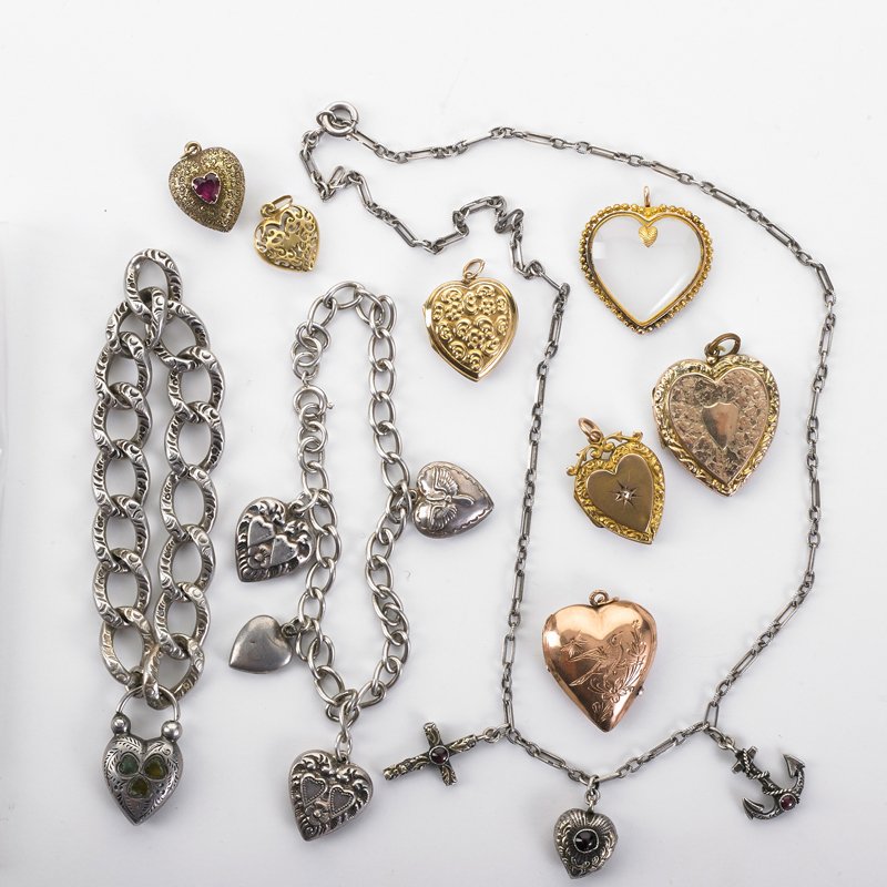 COLLECTION OF VICTORIAN JEWELRY: Ten pieces: Heart lockets or pendants, pierced, embossed or engraved includes examples with agate, garnet and rose cut diamond gold filled, 9k-14k yg; Two charm bracelets and necklace with charms in s