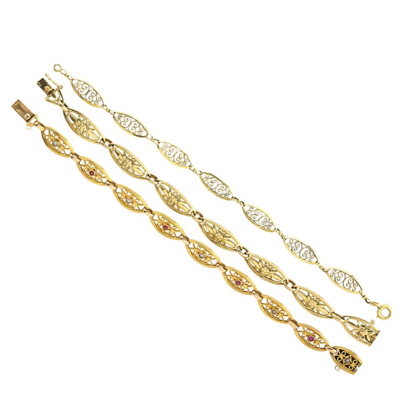 THREE VICTORIAN LOZENGE SHAPED LINK BRACELETS: 18k yg. built and cast filigree, one set with rubies and split pearls. French eagle head marks. Longest 8". 27.5 dwt. GW. Property from the collection of Gray Davis Boone.