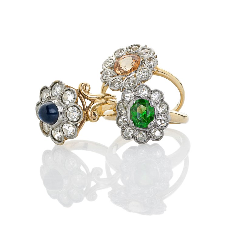 EDWARDIAN GEMSTONE AND DIAMOND CLUSTER RINGS: Platinum topped gold floriform diamond clusters with millegrained detail, includes: .85 ct. demantoid garnet; 1 cts. faceted yellow sapphire; Blue sapphire bullet. Sizes 3 - 5 1/2. 6 dwt. Property fro