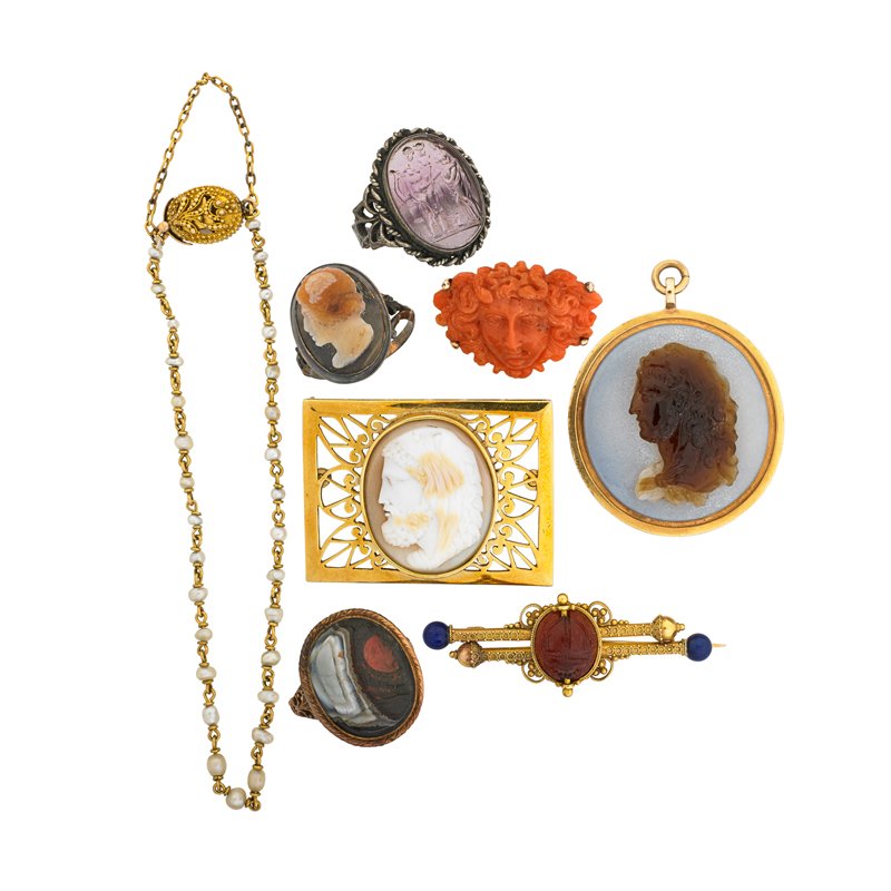 ARCHEOLOGICAL REVIVAL GOLD AND SILVER JEWELRY: Eight pieces: Two hardstone cameo continental gold rings, French import marks; Hardstone cameo gold pendant; Carved coral Medusa gold brooch; Granulated gold and seed pearl bracelet; Carnelian scarab,
