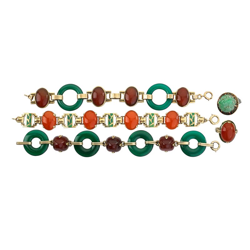 ART DECO 14K YELLOW GOLD AND HARDSTONE JEWELRY: Five pieces includes three link bracelets and two rings in combinations of greens, oranges or brown, chrysoprase, carnelian, carved jade, and enamel, cabochon and sugarloaf cuts. No maker marks noted.