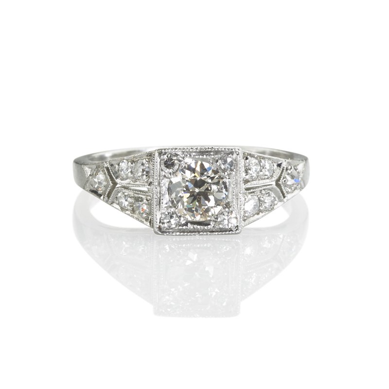 ART DECO DIAMOND PLATINUM RING: Transitional cut diamond, approx. .70 ct., and diamond quarters in illusion box setting to pierced diamond set shoulders, remaining diamonds approx. .38 ct. TW. Size 8 1/4. 2.9 dwt. Property from the