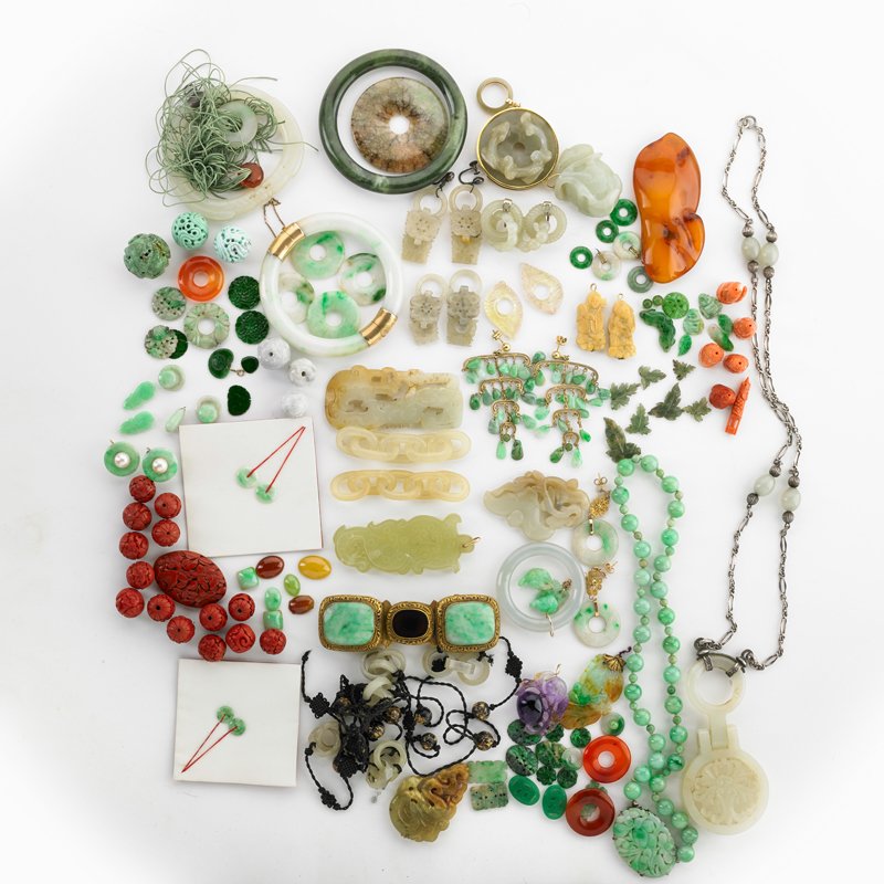 LARGE COLLECTION OF CHINESE CORAL, JADE, ETC.: Estate collection includes jade cabochons, carvings, disks, links, bangles, buckle earrings, pendants. Include gold, turquoise, carnelian, pearl, nephrite, carved cinnabar. Al least 100 pieces. 19th/2