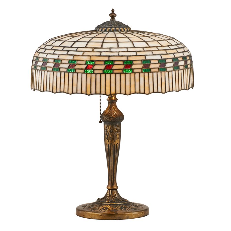LAMB AND GREENE LEADED GLASS LAMP: Geometric design shade on bronze base, early 20th c.; Lamb and Greene sticker on base; 23 1/2" x 18"