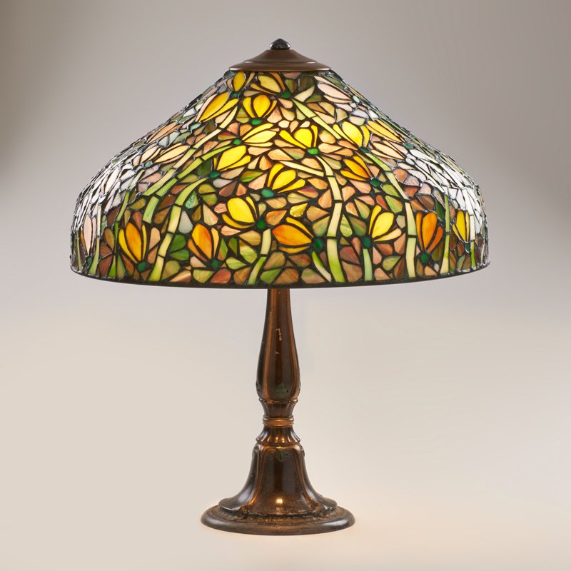 BRADLEY & HUBBARD (Attr.): Patinated metal table lamp base married to newer leaded slag glass shade, USA, ca. 1910s; Unmarked; 22 1/2" x 19" dia.