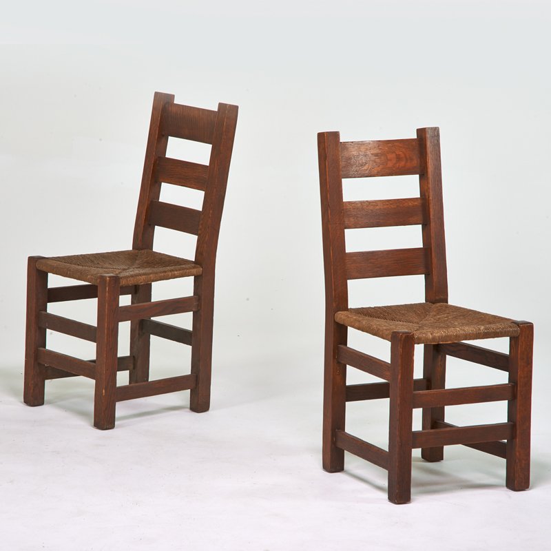 STICKLEY BROS.: Pair of ladder back side chairs, Grand Rapids, MI, ca. 1915; Quartersawn oak, rush; Unmarked; 37 1/4" x 16 1/2" x 18 1/2"