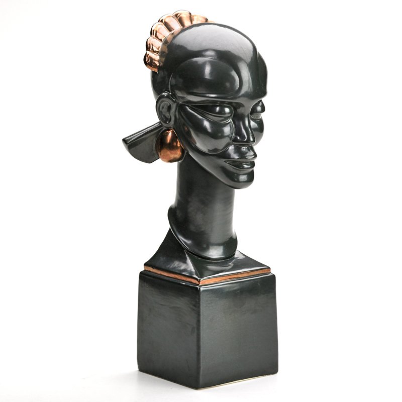 WAYLANDE GREGORY; COWAN POTTERY: Art Deco bust covered in black and copper glaze, ca. 1930; Porcelain; Signed "W Gregory"; 16" x 6" sq.