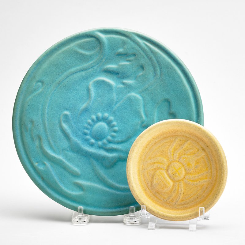 VAN BRIGGLE: Two pieces: trivet and saucer, Ming Blue and yellow glazes, Colorado Springs, CO, 1908-1911; Marked "AA 18 COLO SPGS 12" and obscured marking "AA 11 VAN BRIGGLE COLO SPGS 623"; Larger: 8 1/2" dia.